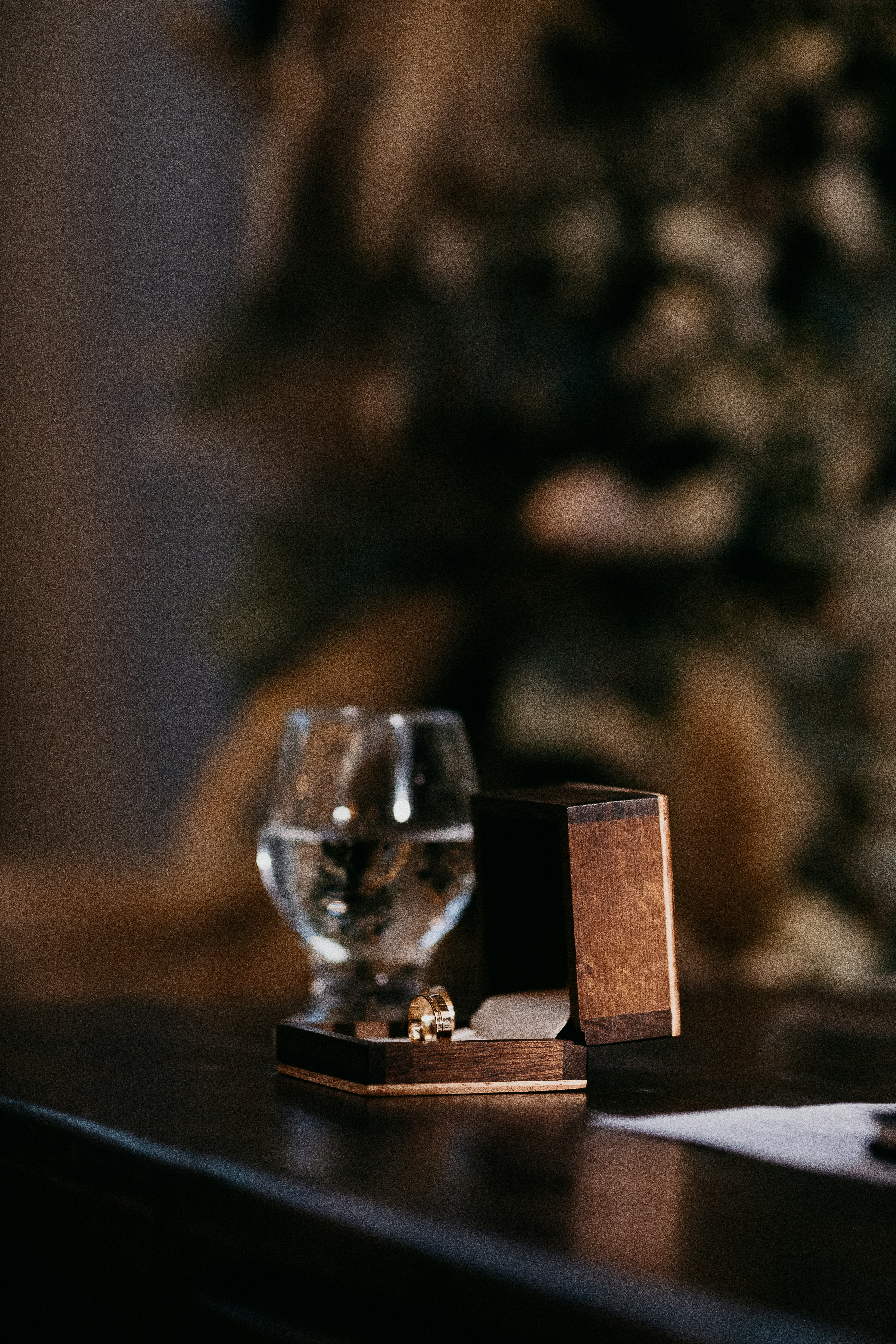 clear glass candle holder on brown wooden table